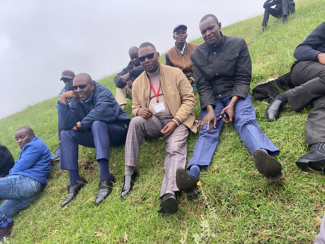Students resting on hillside in Ngong Hills