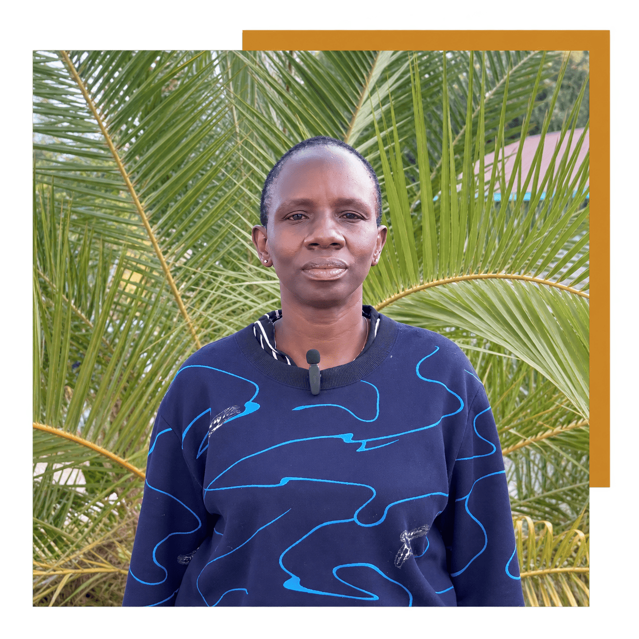 Beatrice in navy with gold border Pastor Beatrice Oloo